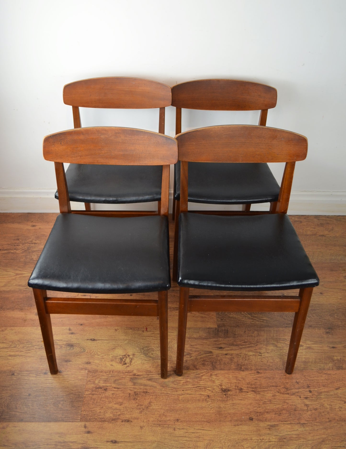 A Set Of Mid Century Dining Chairs