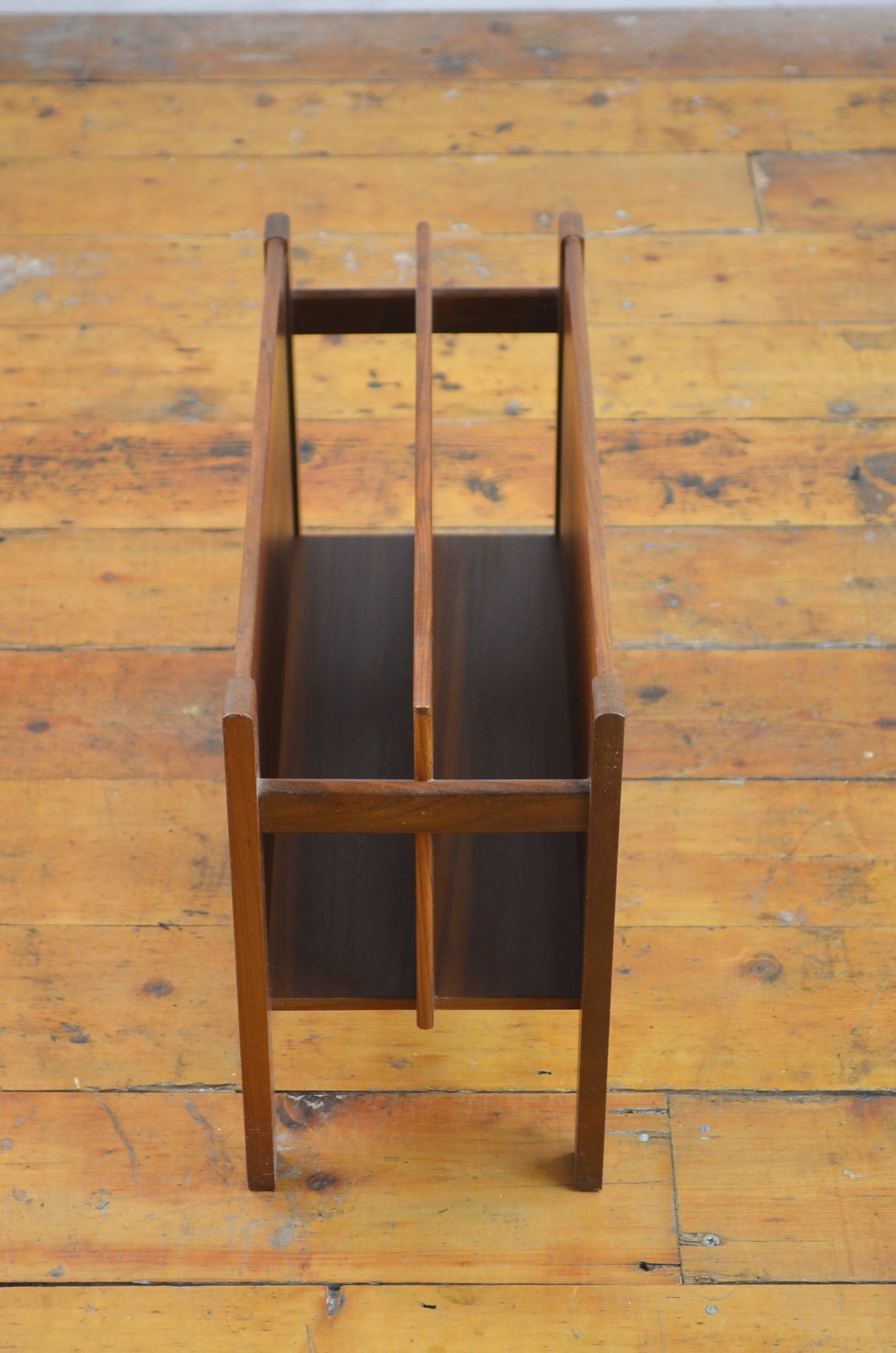 A 20th century danish teak magazine rack - Canterbury by Guy Rogers.