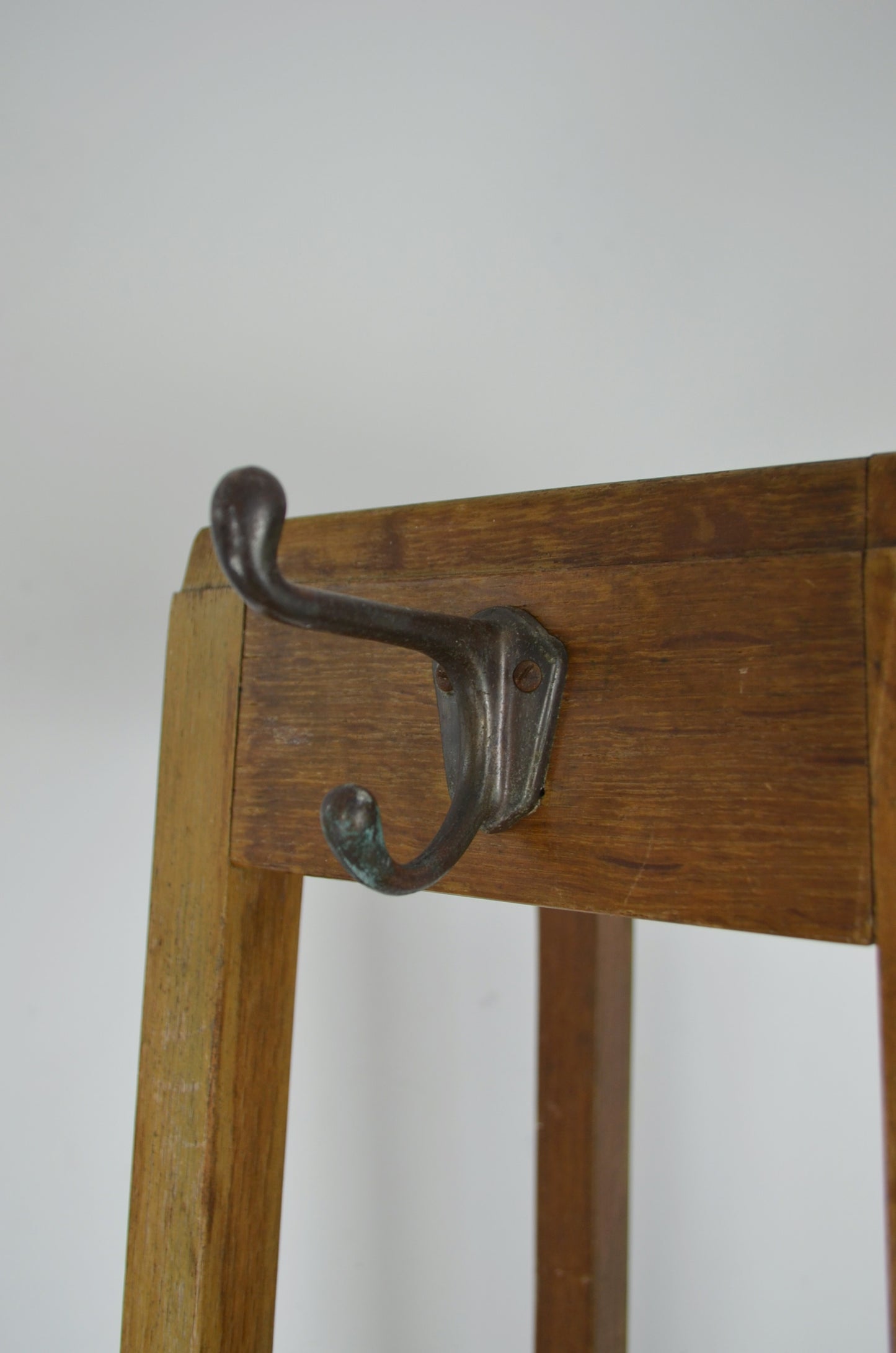 A vintage mid century oak framed Industrial office hall stand