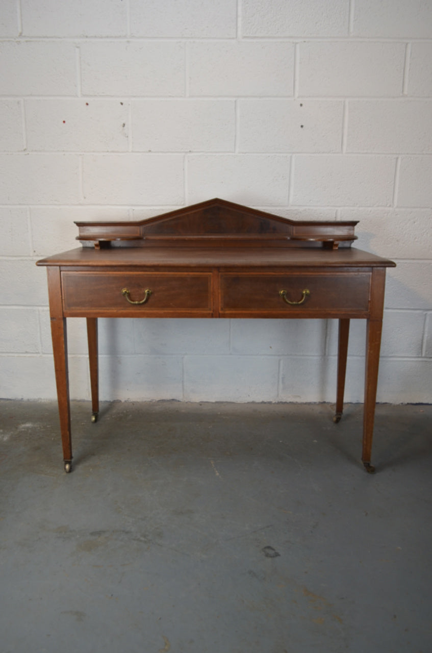 An Antique Desk by Maple & Co