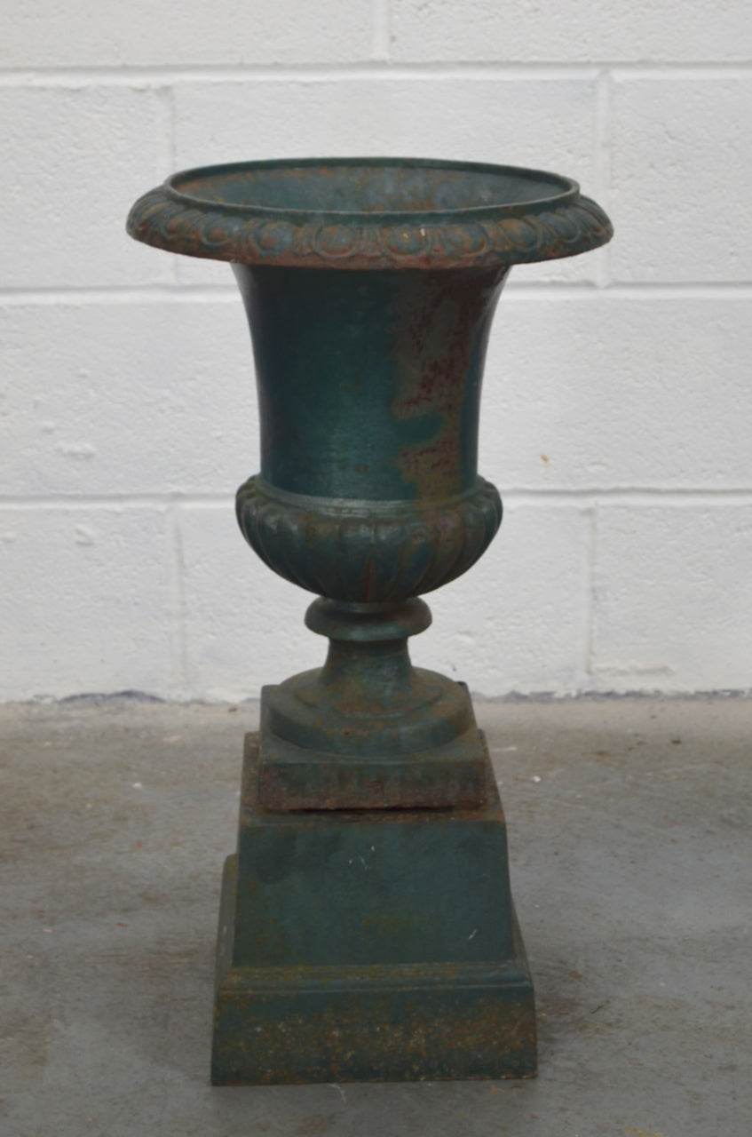 An Antique Urn On Plinth Base