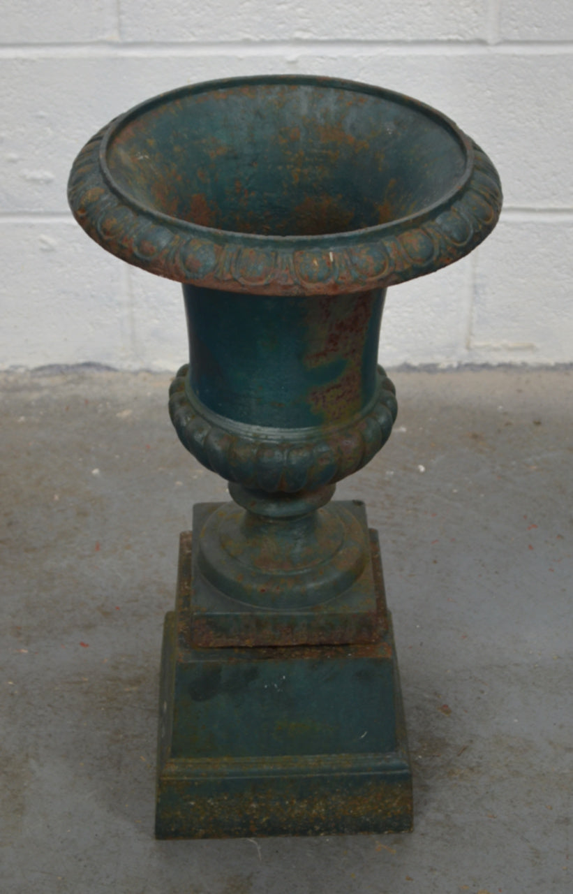 An Antique Urn On Plinth Base