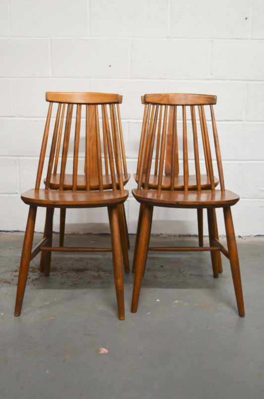 A Set Of Four Vintage Dining Chairs