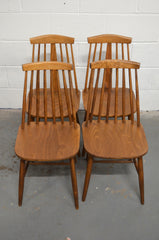 A Set Of Four Vintage Dining Chairs