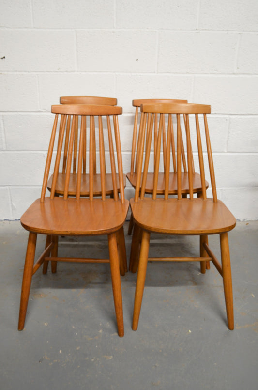 A Set Of Four Vintage Dining Chairs