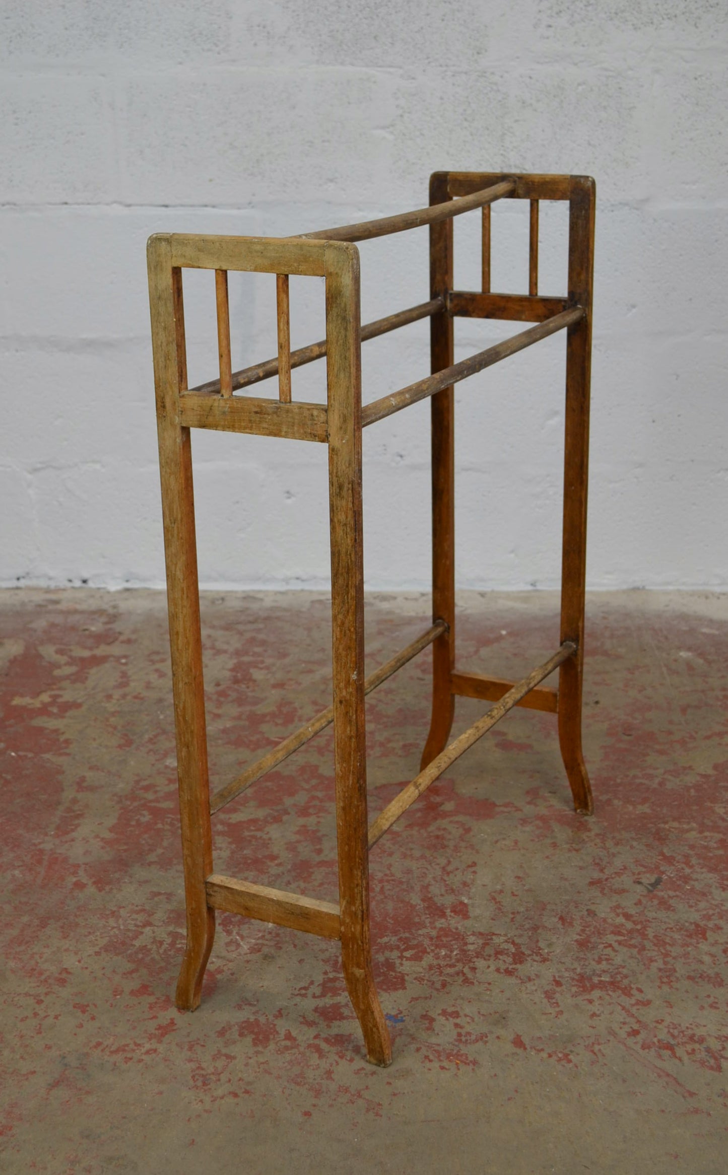 An Antique Towel Rail With Five Supports