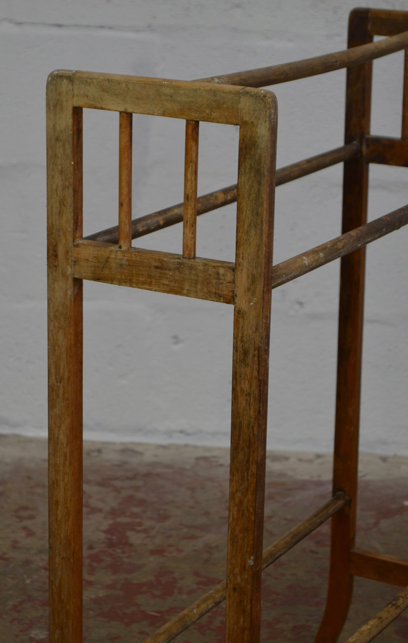 An Antique Towel Rail With Five Supports