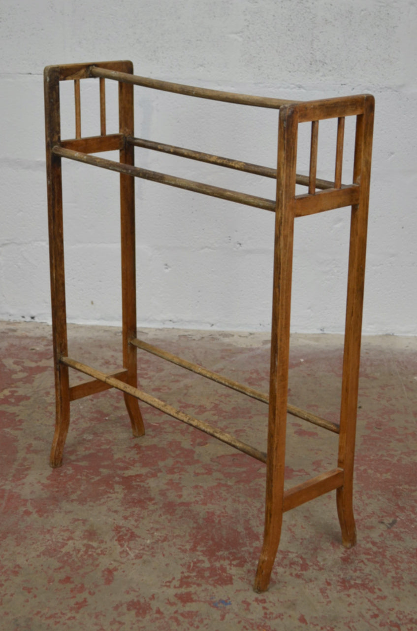 An Antique Towel Rail With Five Supports