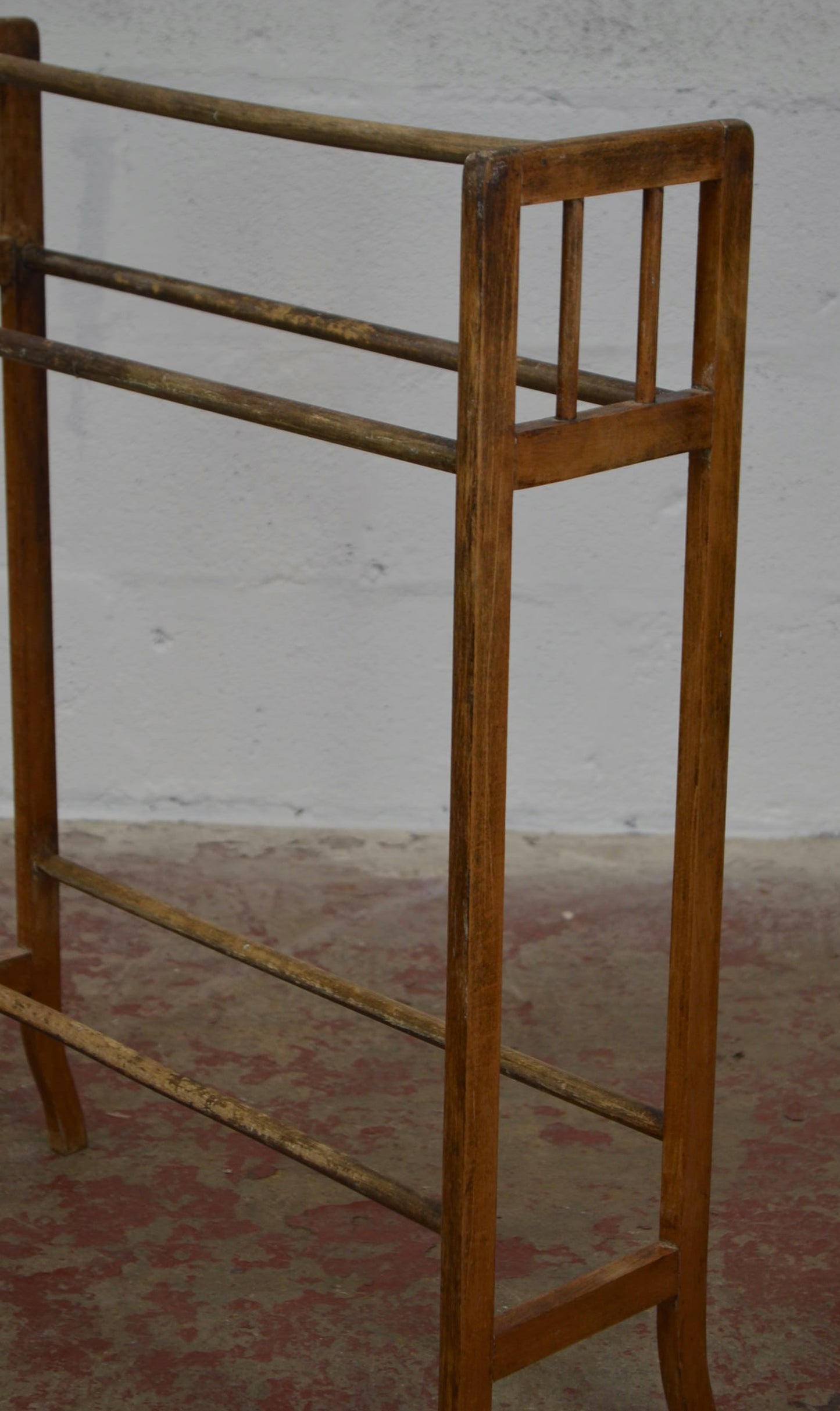 An Antique Towel Rail With Five Supports
