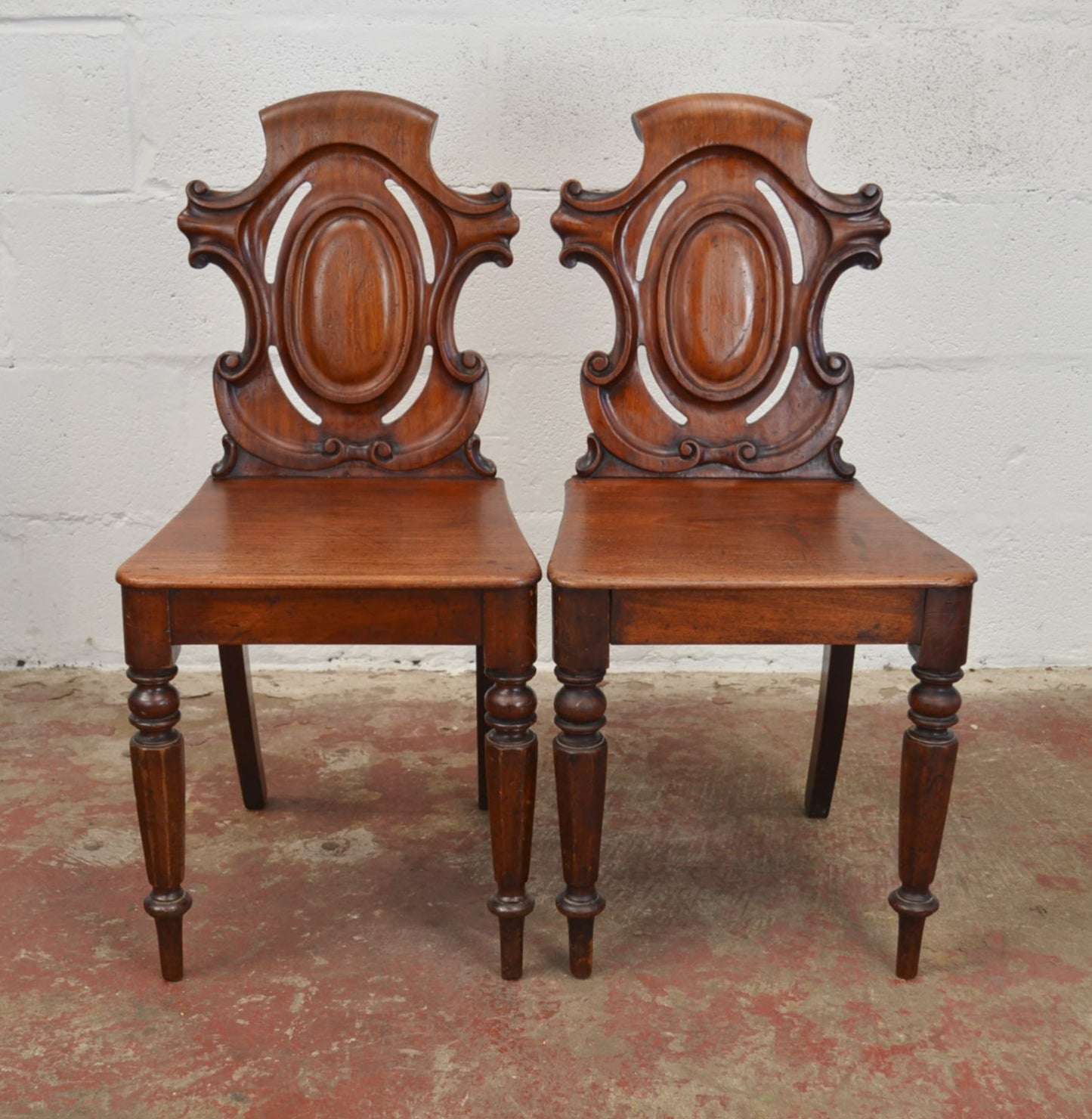 A Pair Of Antique Victorian Mahogany Hall Chairs