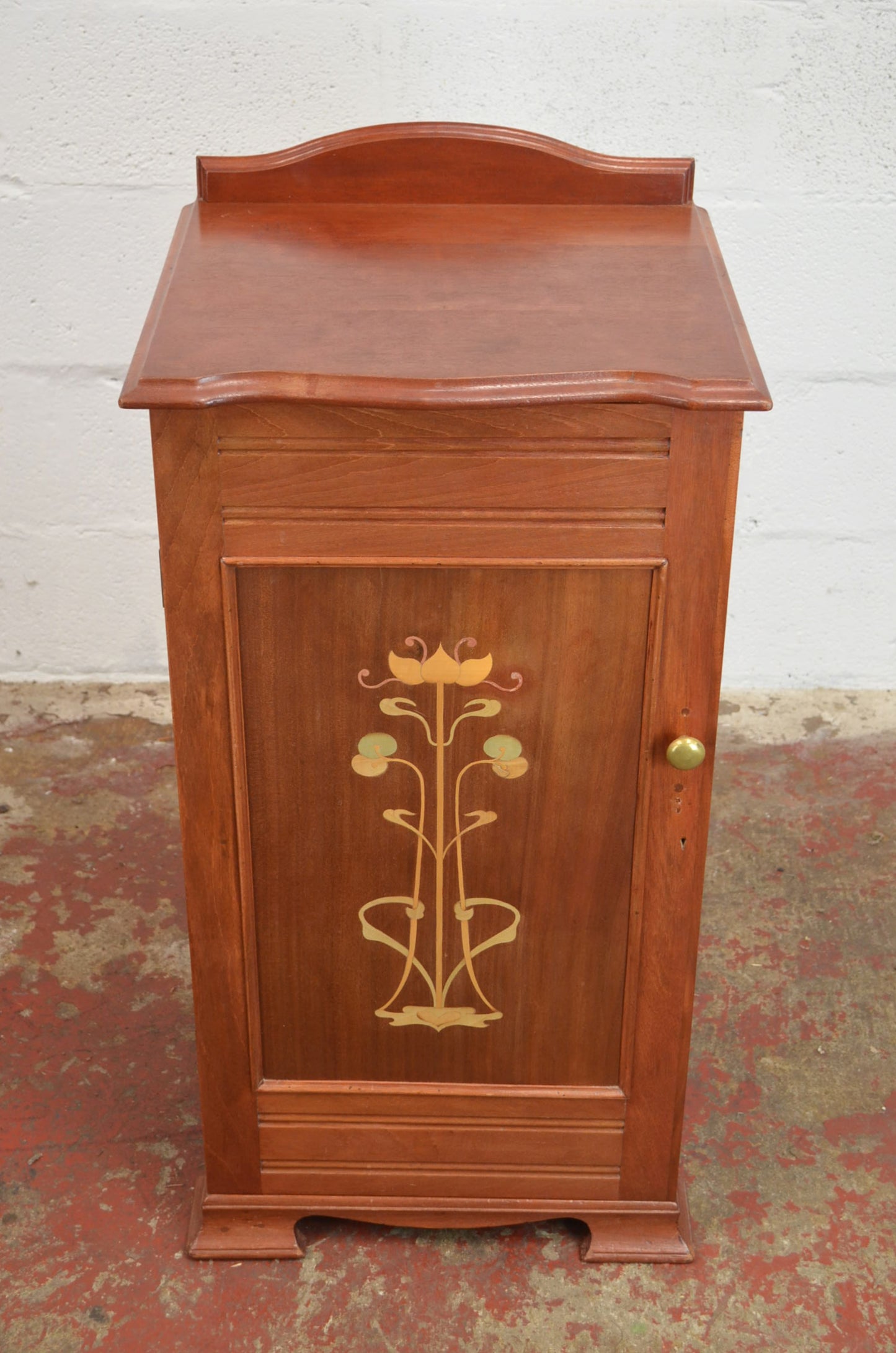 An Art Nouveau Side Cupboard With Flower Door