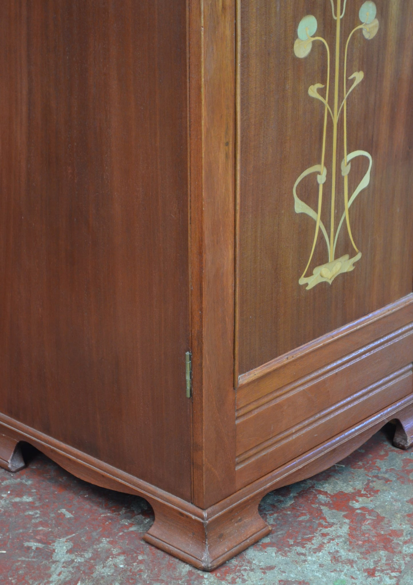 An Art Nouveau Side Cupboard With Flower Door