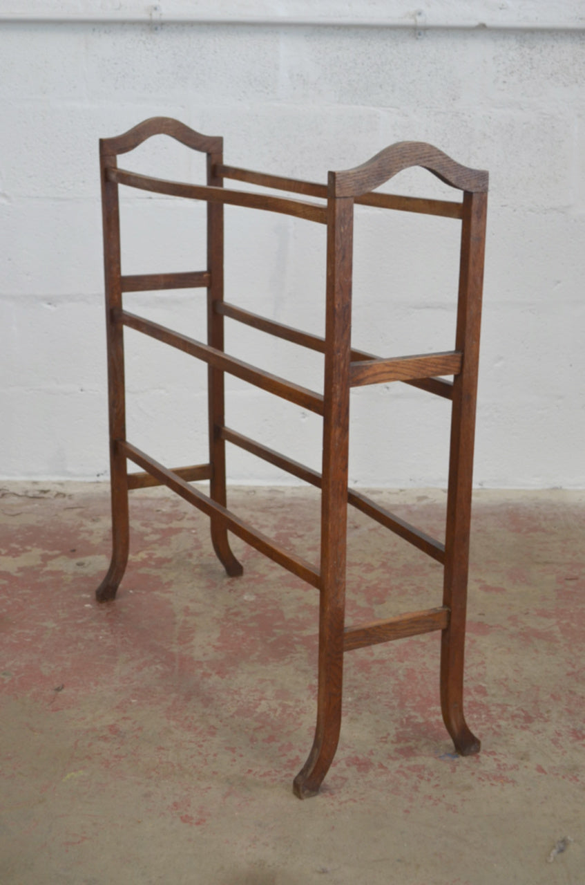 An Antique Towel Rail With Six Supports