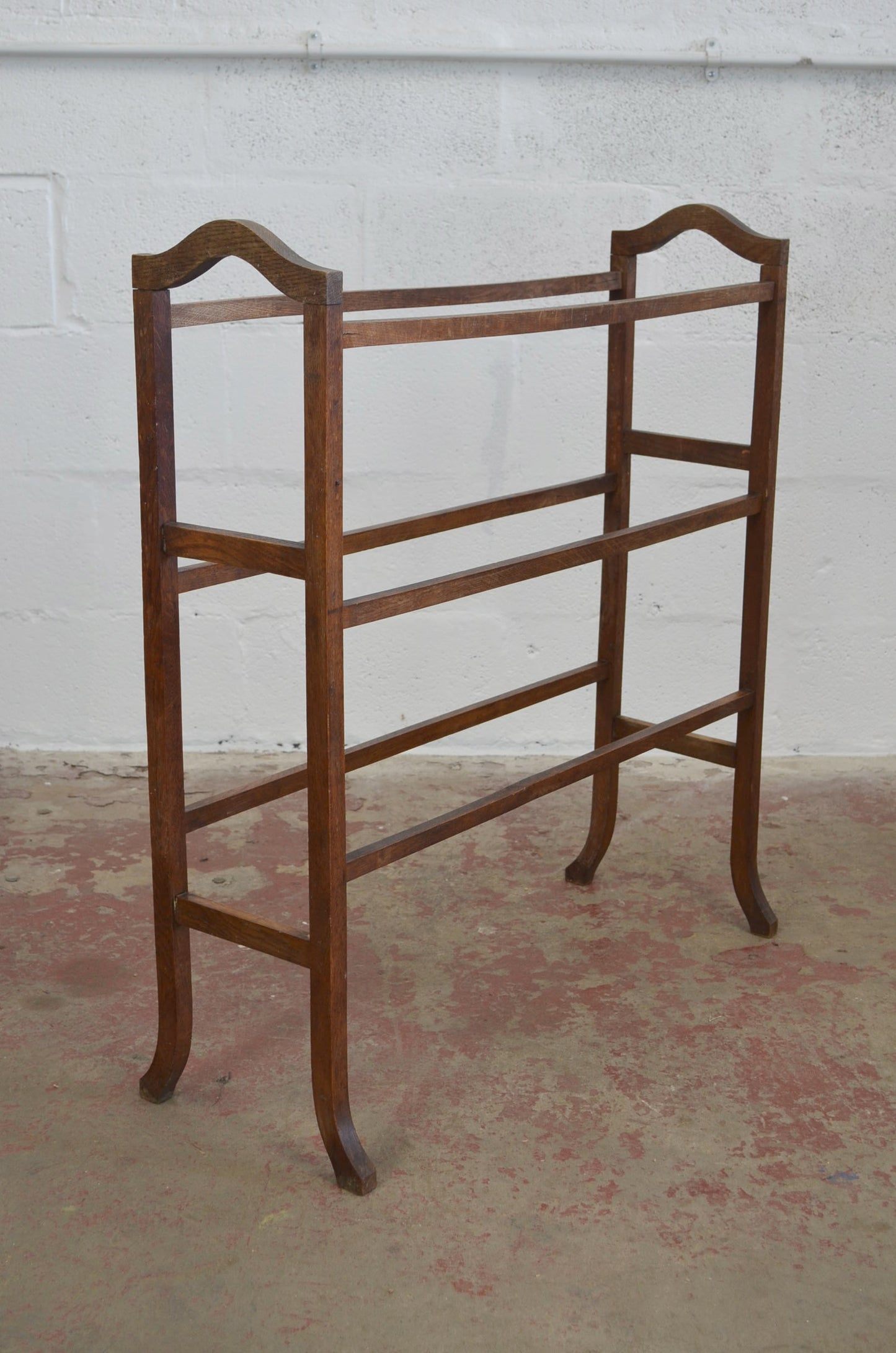 An Antique Towel Rail With Six Supports