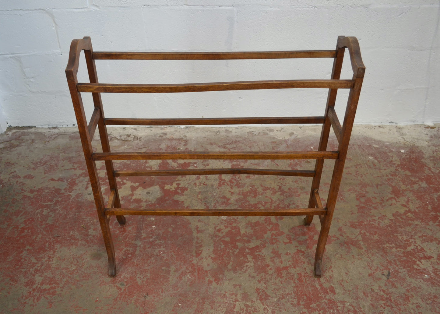An Antique Towel Rail With Six Supports