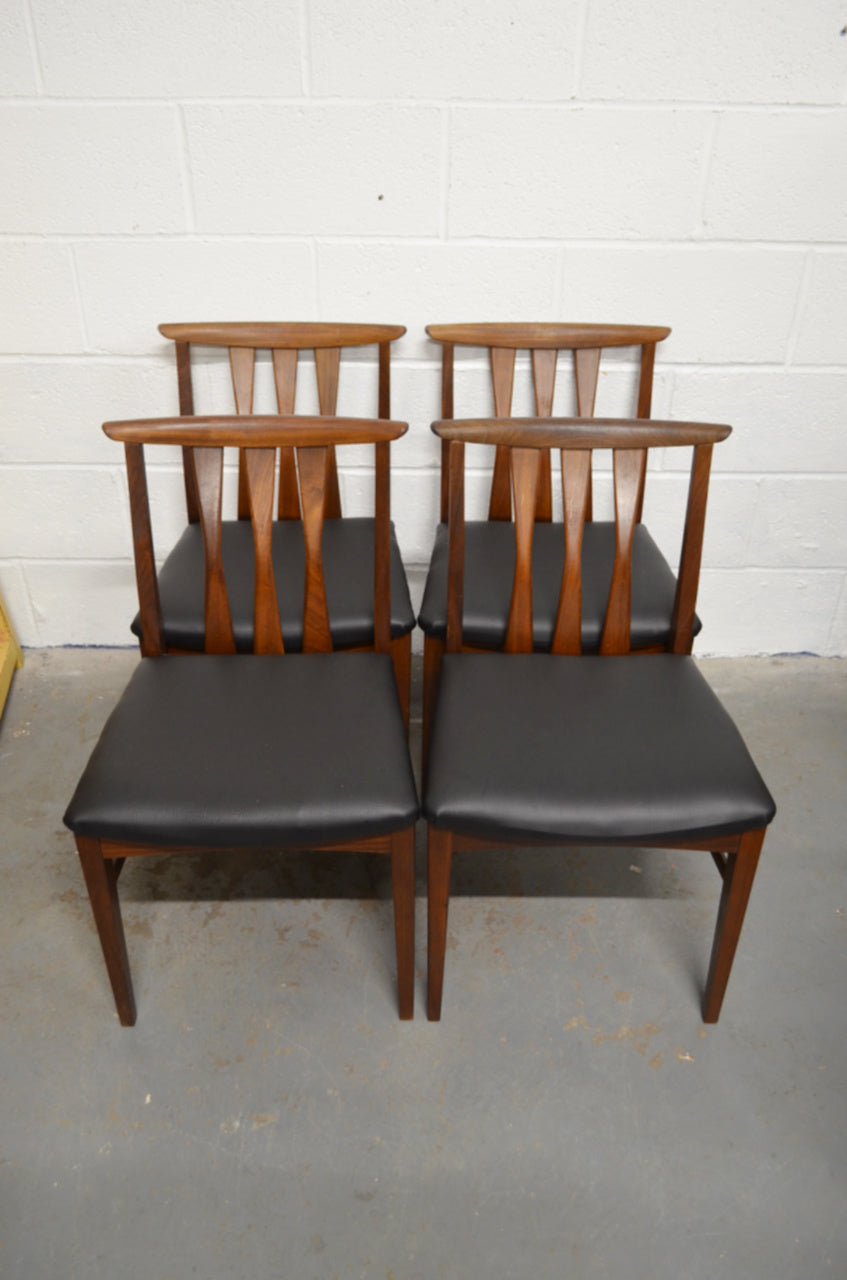 A Set Of Four Vintage Dining Chairs