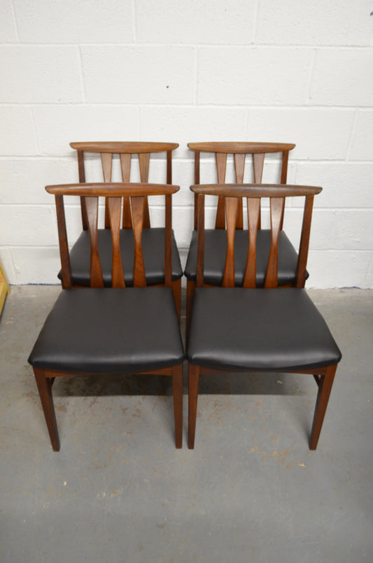 A Set Of Four Vintage Dining Chairs