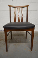 A Set Of Four Vintage Dining Chairs
