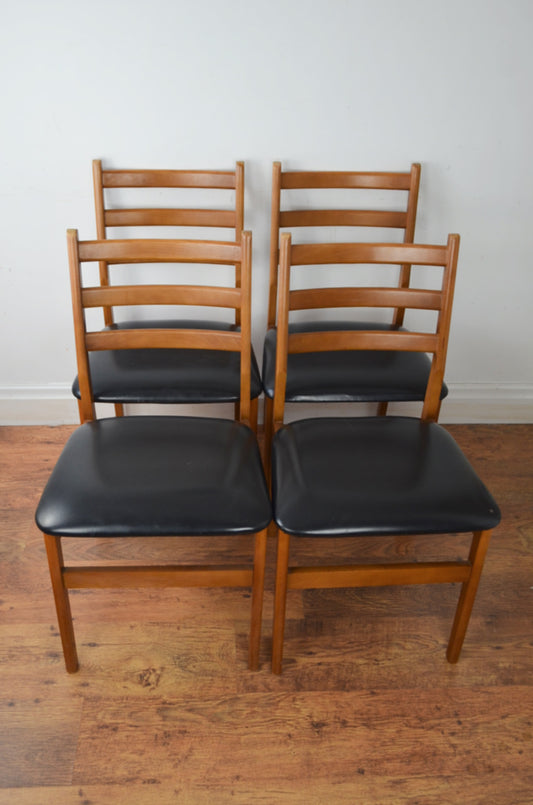 A Set Of Four Vintage Dining Chairs
