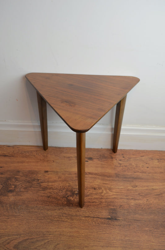 Unusual triangular mid century corner/side table with triangular legs and veneered top. 