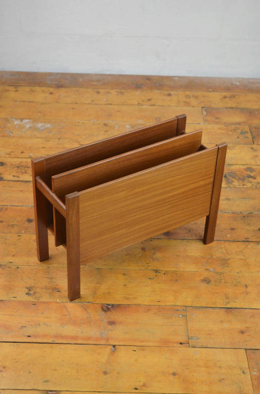 A 20th century danish teak magazine rack - Canterbury by Guy Rogers. 