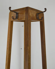 A vintage mid century oak framed Industrial office hall stand